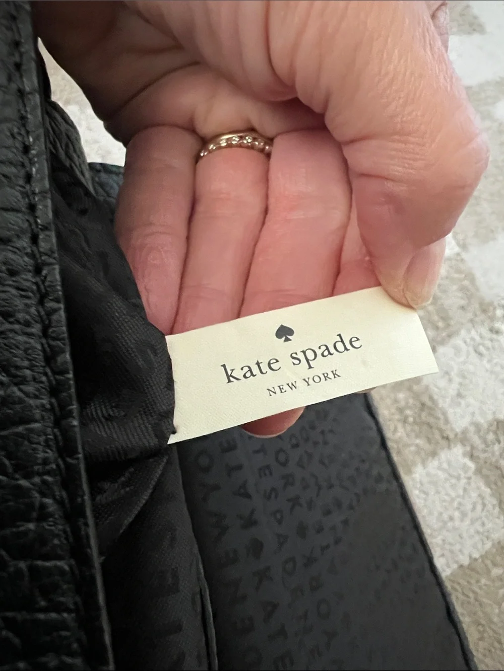 kate spade Black Pebbled Leather Backpack with Gold-Tone Turn Lock
